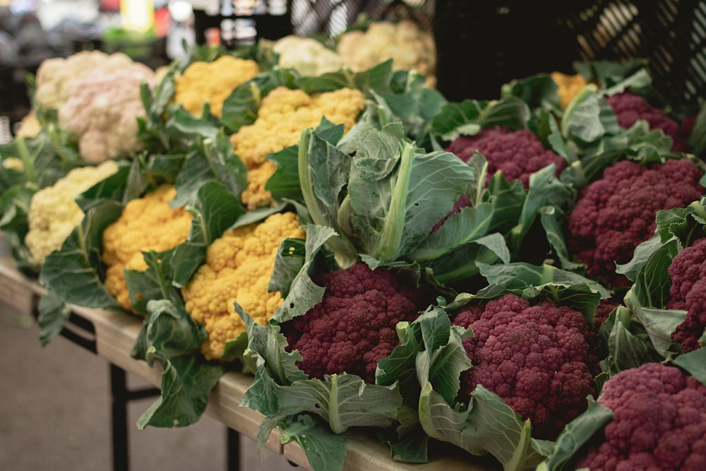 a bunch of broccoli and cauliflower on a table