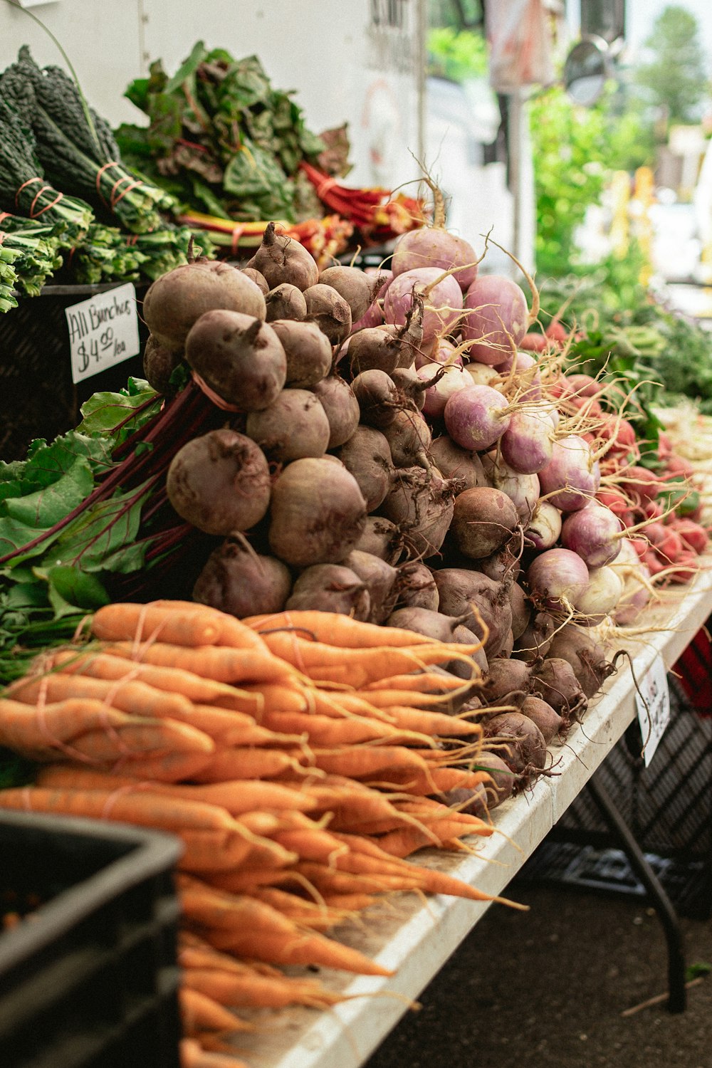 a bunch of carrots and other vegetables on a table