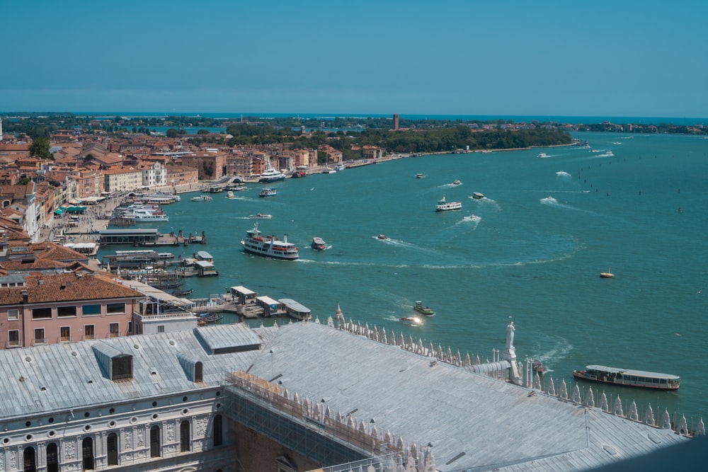 a harbor filled with lots of boats next to a city