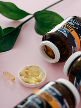 a bottle of fish oil next to two bottles of fish oil