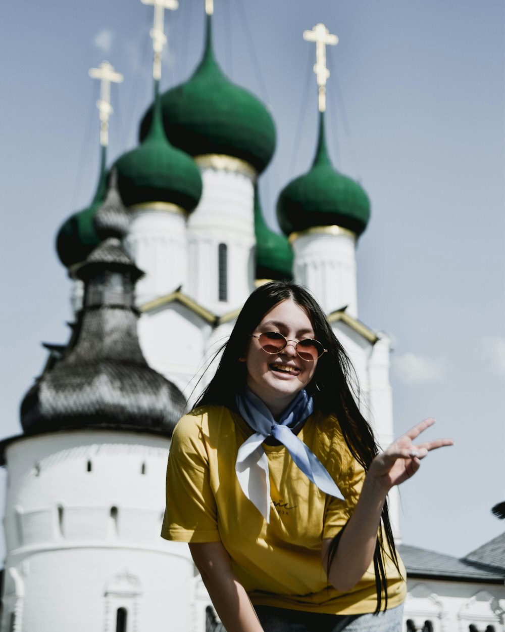 a woman standing in front of a church