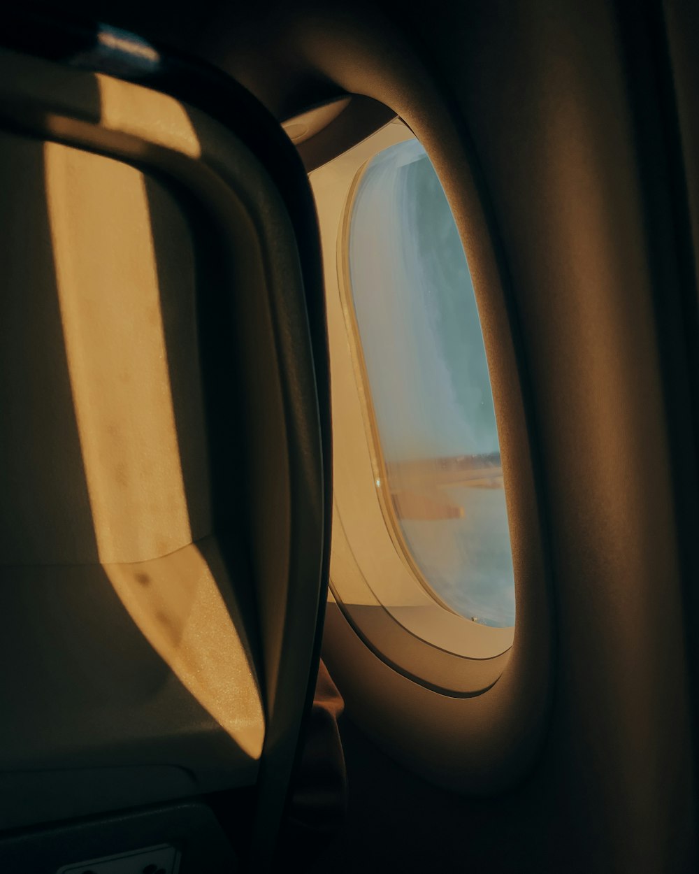 a view of the wing of an airplane through a window