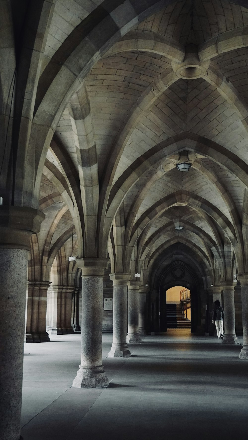 a large building with columns and arches