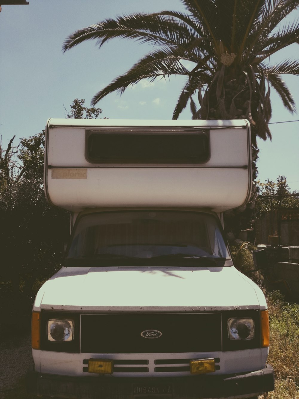 a white truck with a camper on top of it