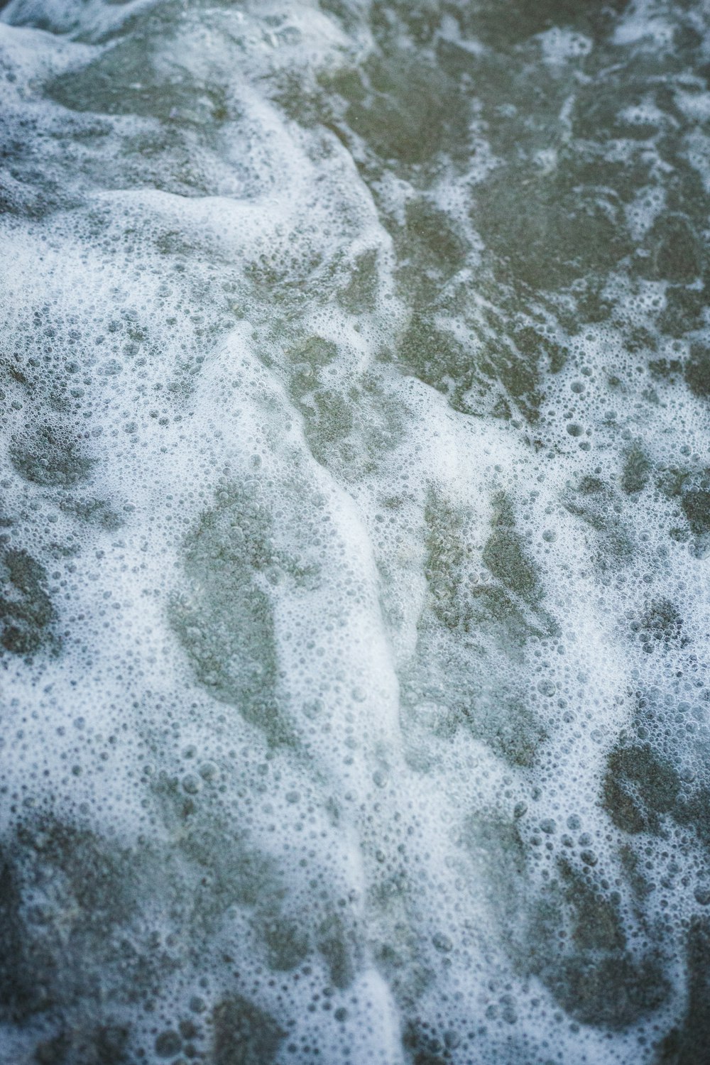 a close up of a surfboard in the water