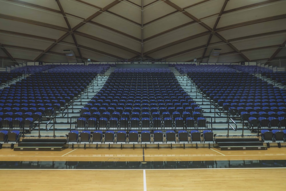 a basketball court with rows of empty seats