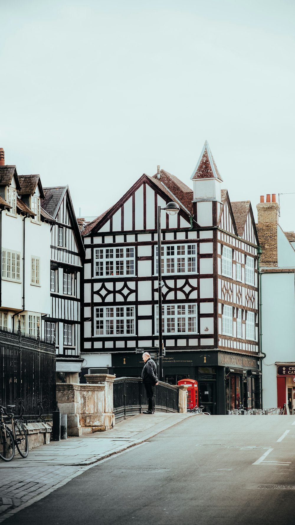 a couple of people that are standing in front of a building