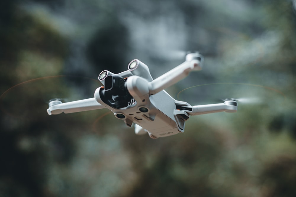 a close up of a white and black flying object