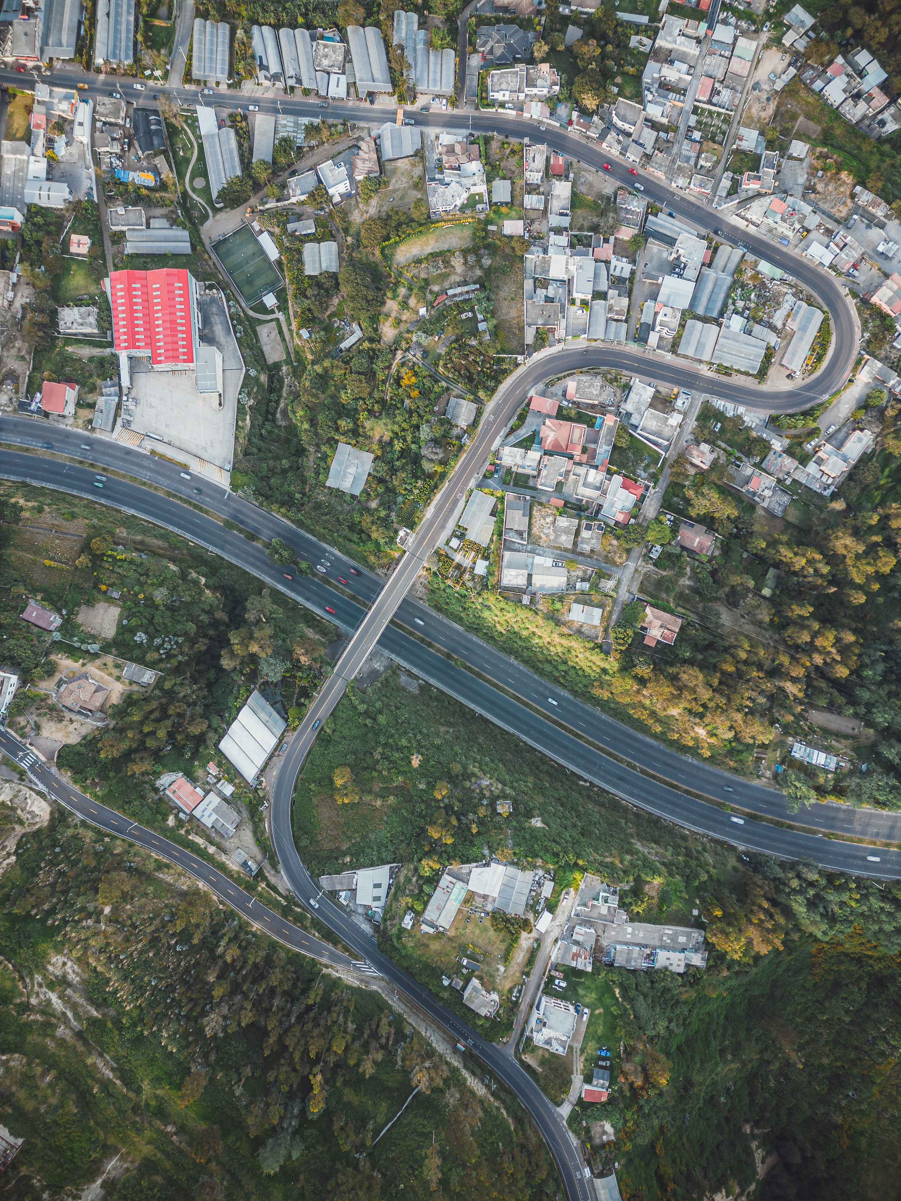 an aerial view of a road intersection in a city