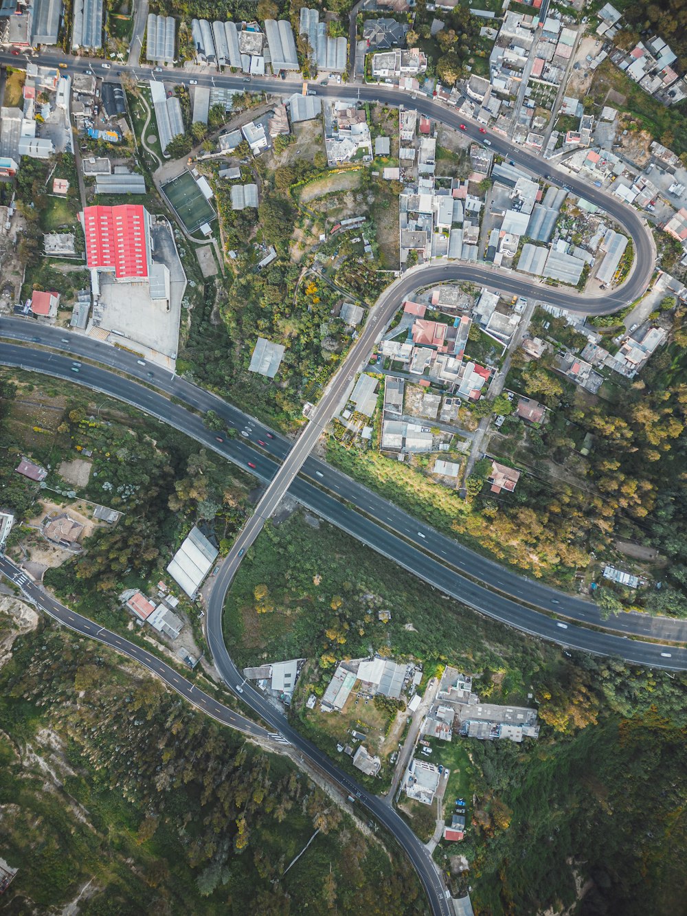 an aerial view of a road intersection in a city