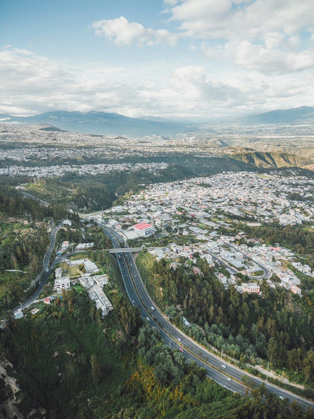 an aerial view of a city and a highway