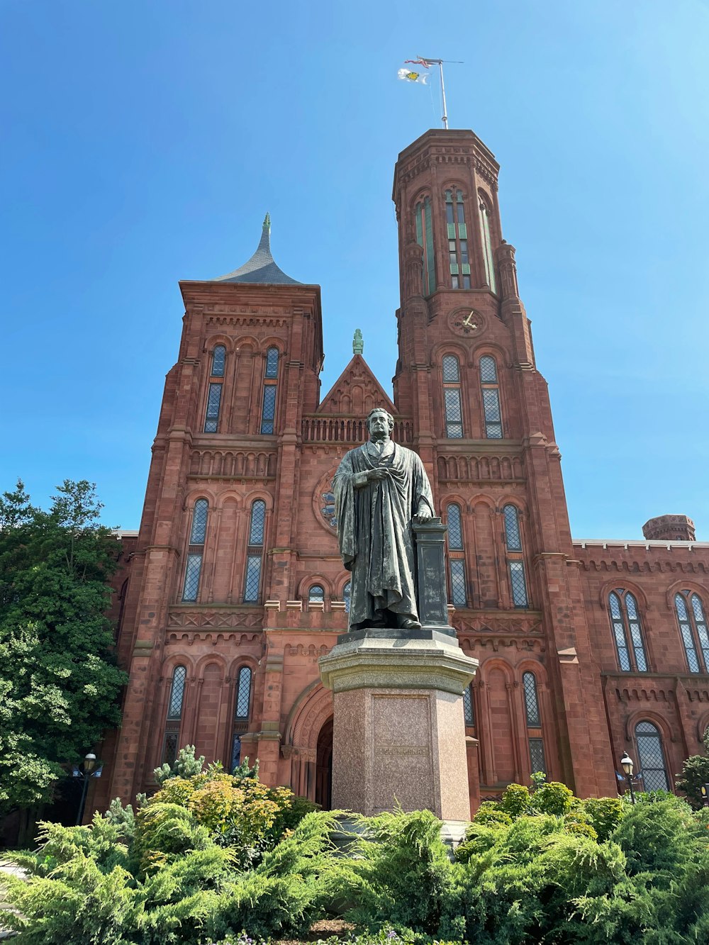 a statue of a man in front of a large building