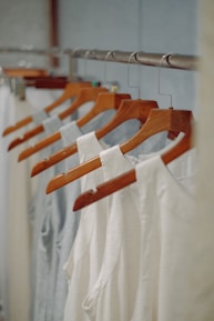 a row of clothes hanging on a rail