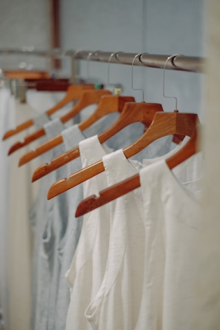 a row of clothes hanging on a rail