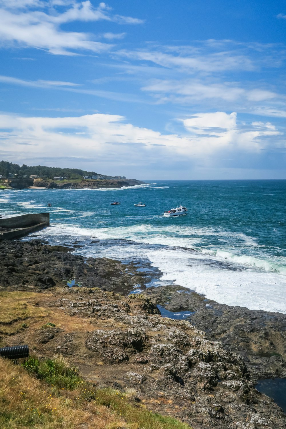 a view of a beach with boats in the water