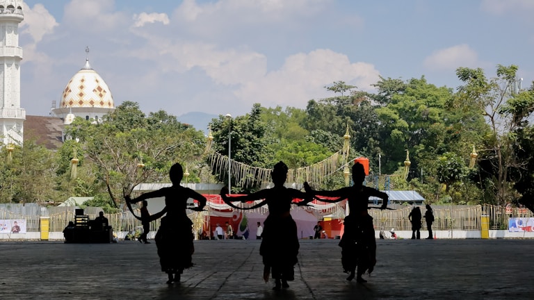An outdoor improvisation session with dancers in motion against a natural backdrop.