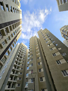 looking up at tall buildings in a city