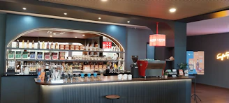 A modern cafe inventory management dashboard showing stock levels with color-coded indicators.