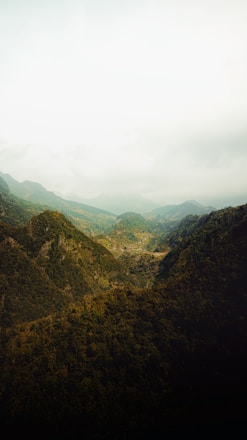 A scenic view of lush green mountains and coffee plantations in Marsella, Risaralda.