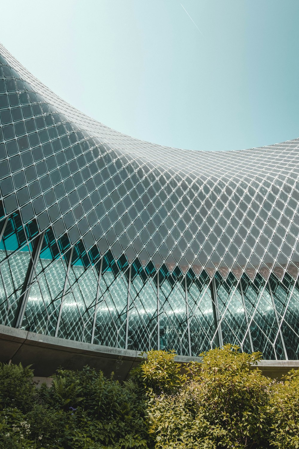 a large building with a triangular design on it's side