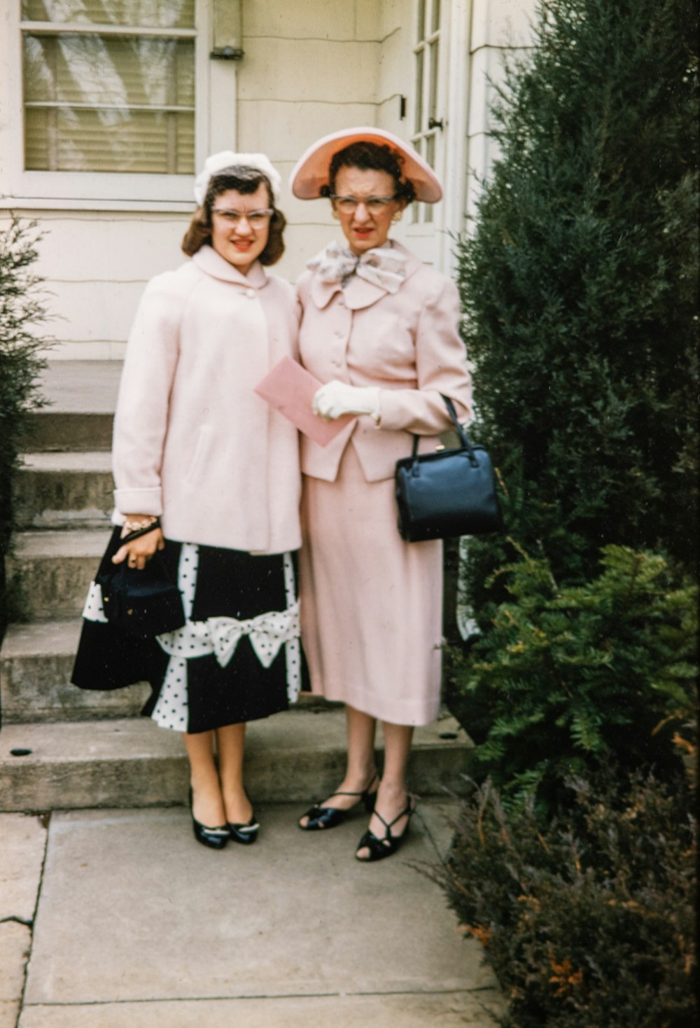 a couple of women standing next to each other