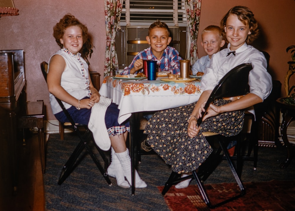 a group of people sitting around a table