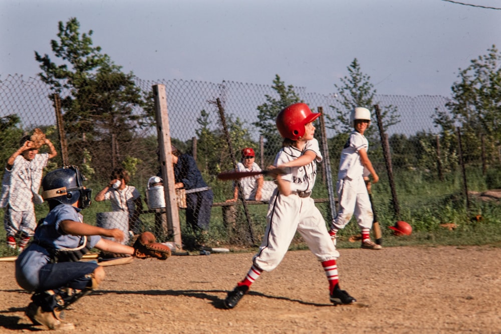 a group of young boys playing a game of baseball