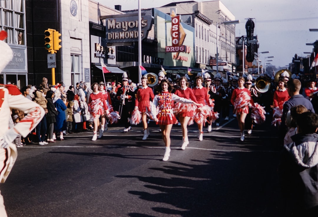 a group of cheerleaders marching down a street,