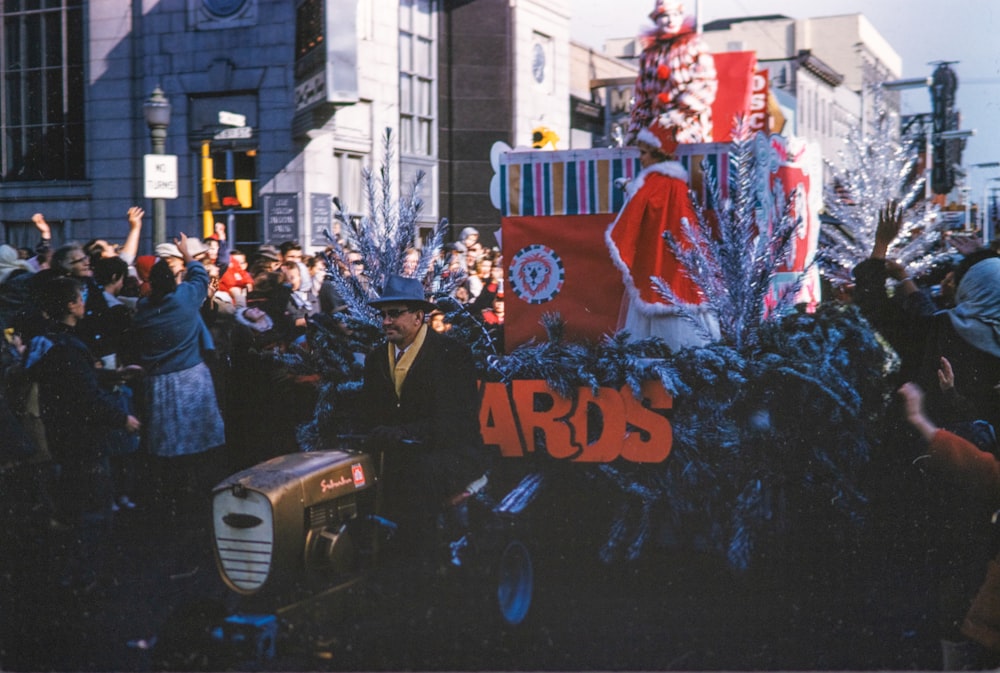 a large group of people standing around a float