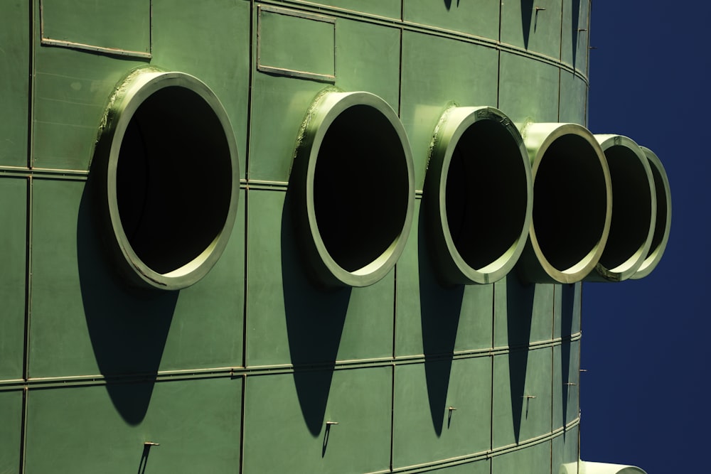 a row of round windows on the side of a building