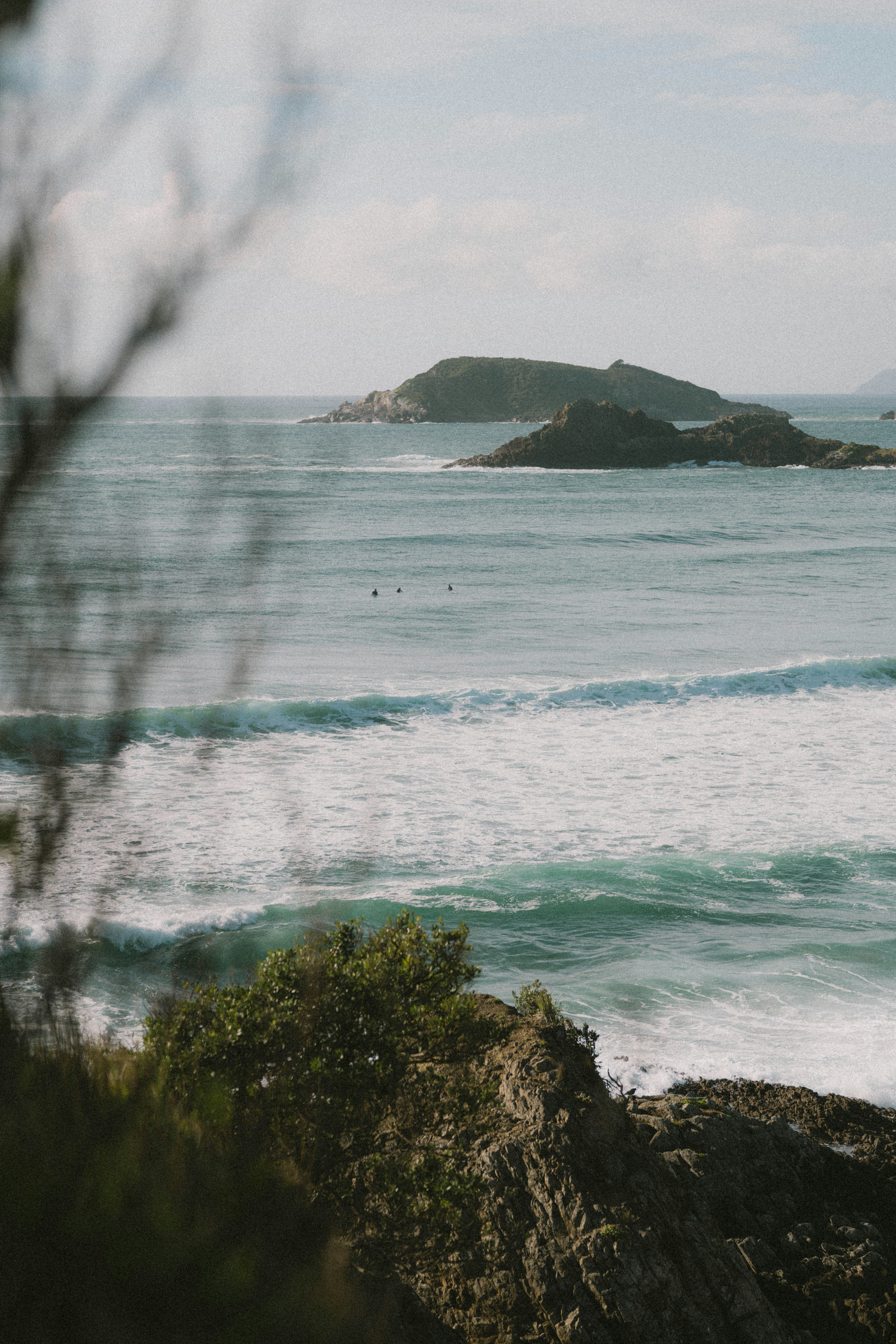a person riding a surfboard on a wave in the ocean