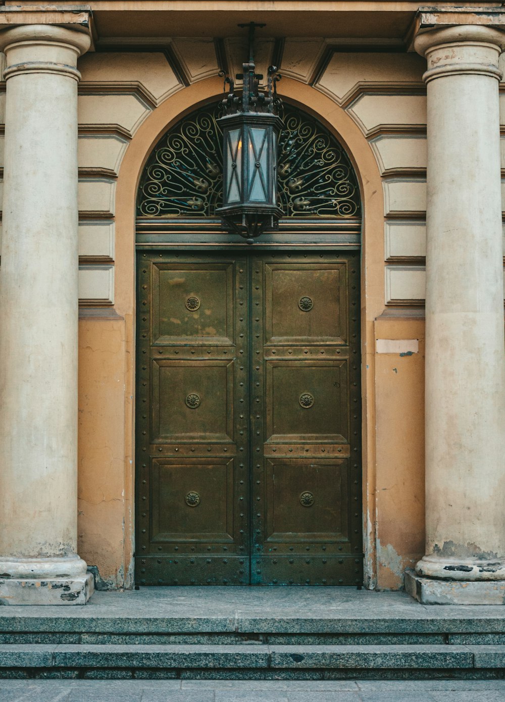 a couple of large wooden doors in front of a building