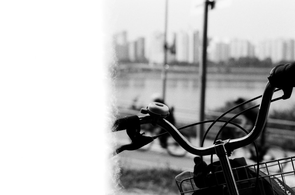 a black and white photo of a bicycle with a basket