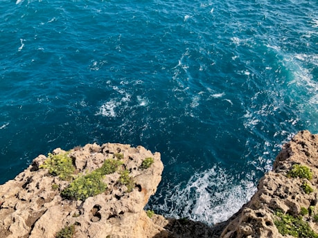 a view of a body of water from a cliff