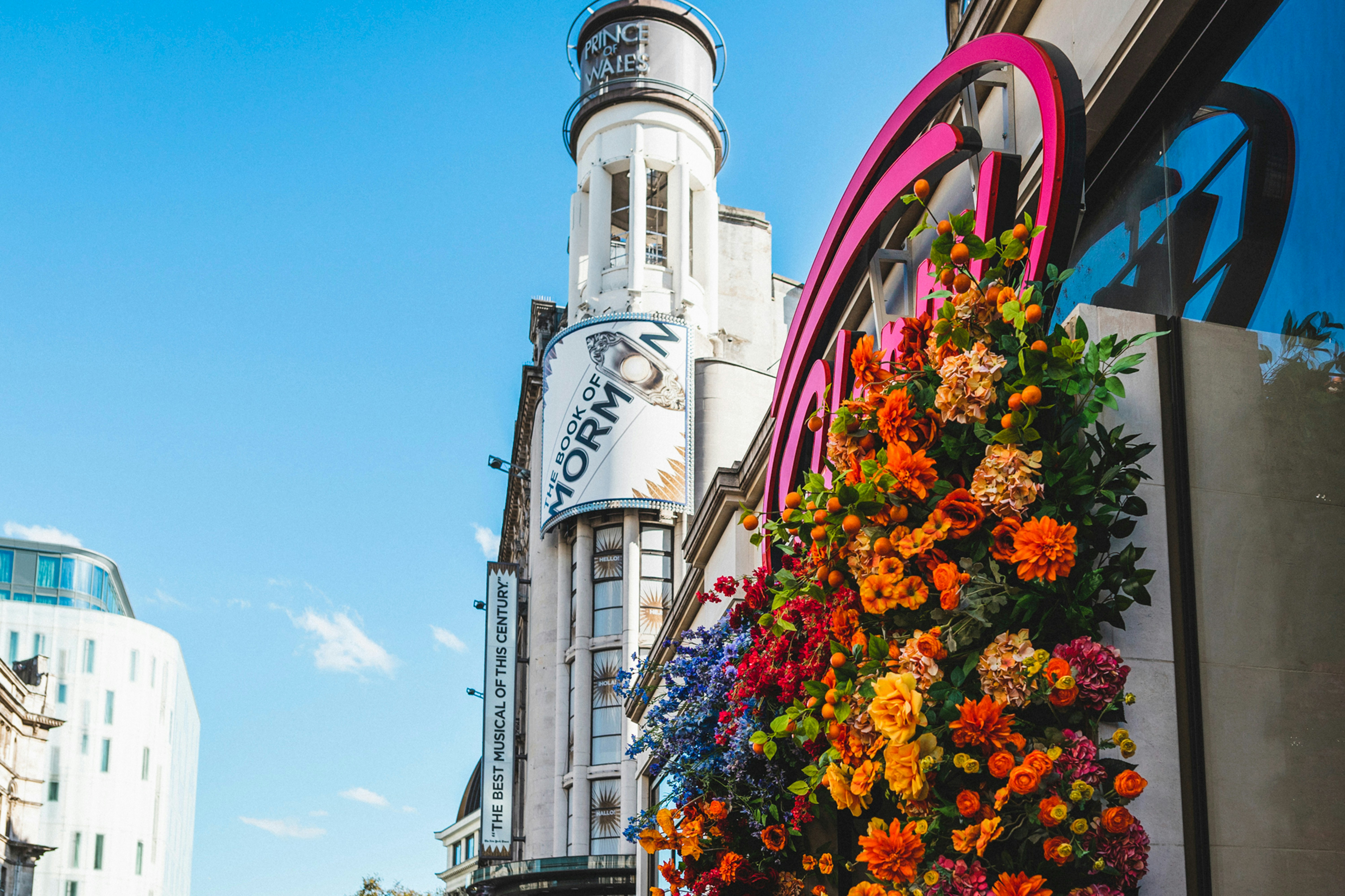a tall building with a clock tower in the background
