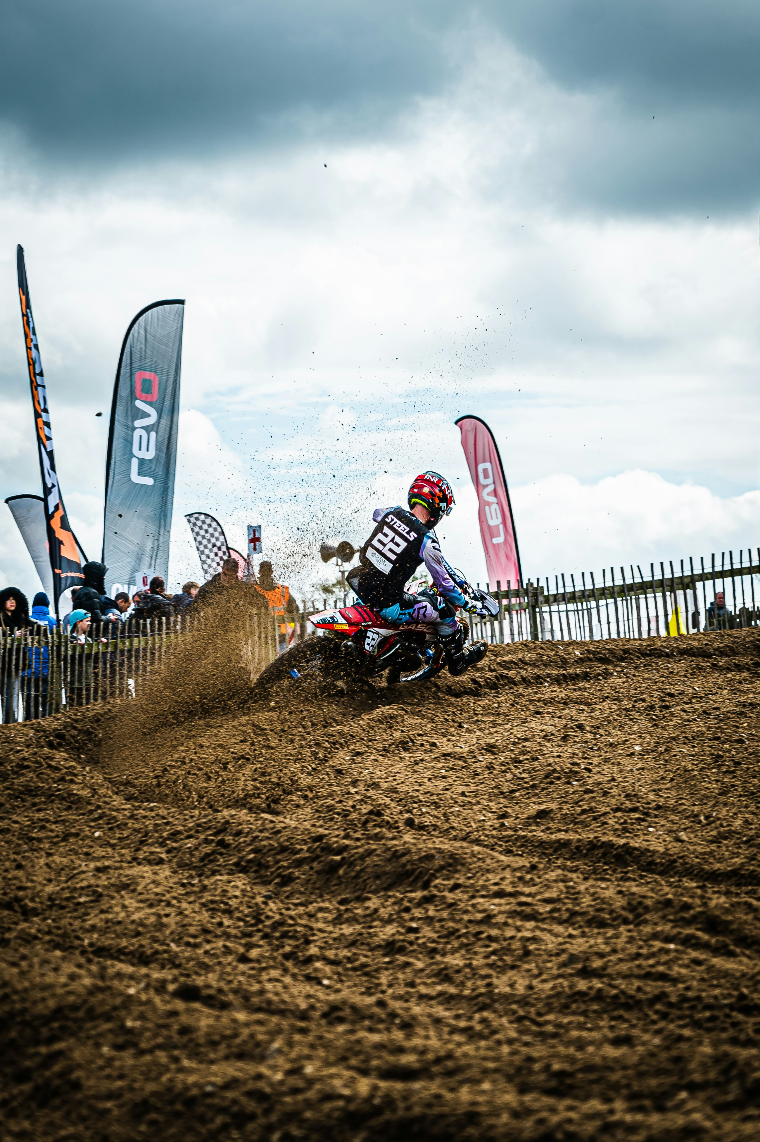 a man riding a dirt bike on top of a dirt field