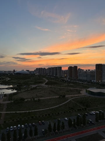 A Melbourne cityscape at sunset with subtle green overlays symbolizing carbon capture technology.