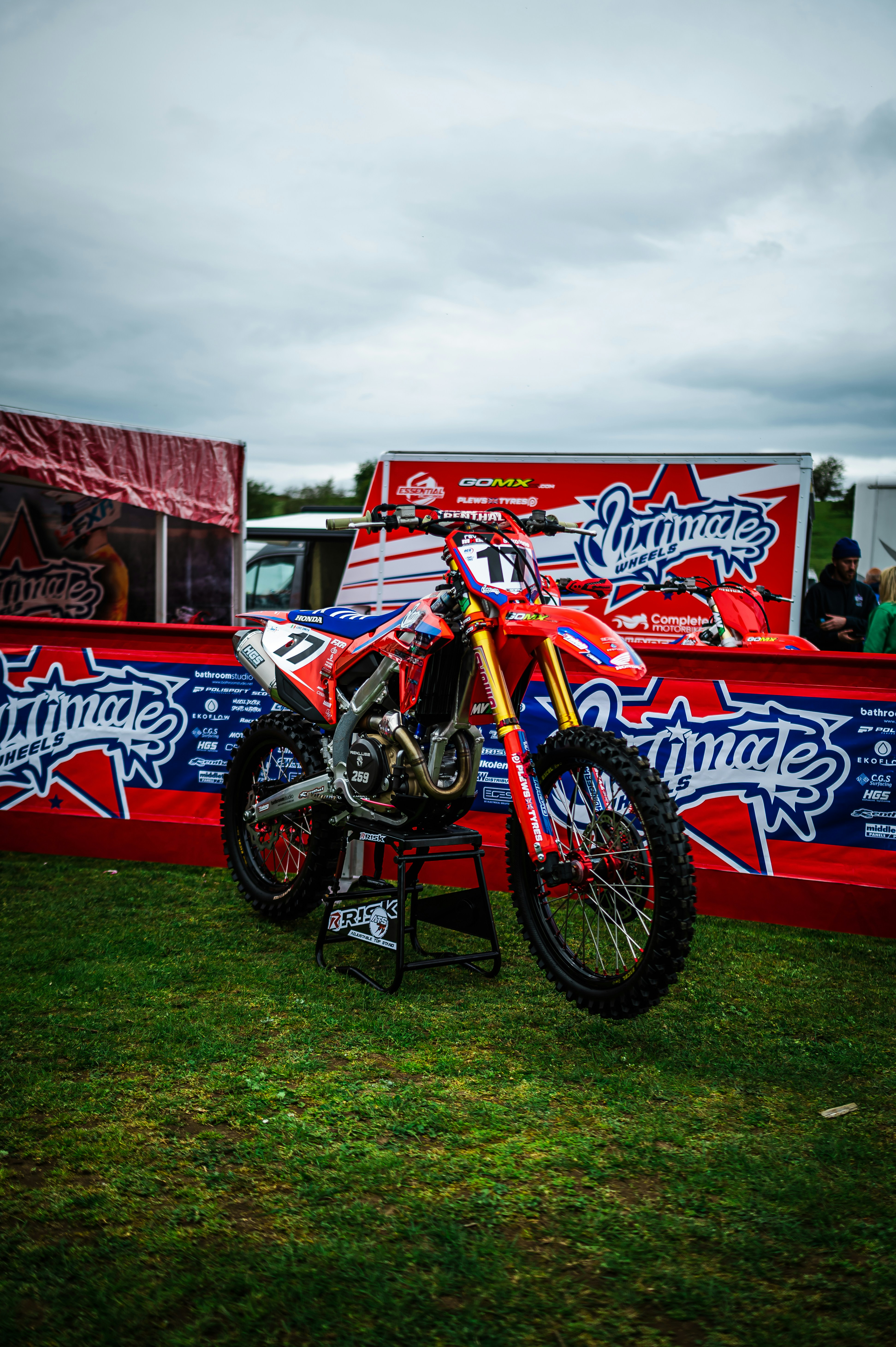 a dirt bike parked on top of a lush green field