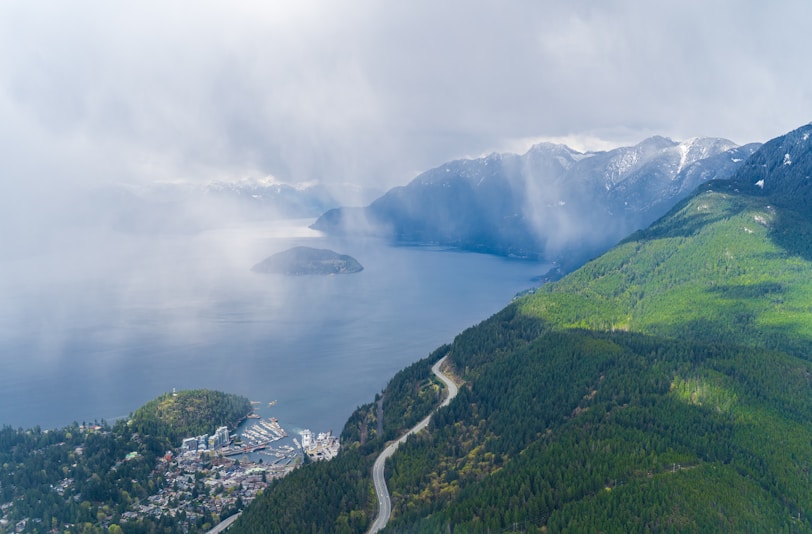 a scenic view of a city and a body of water