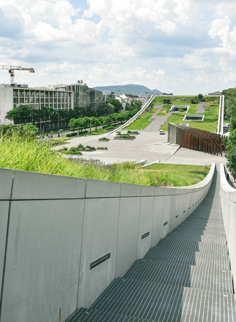 a view of a skate park from the top of a ramp