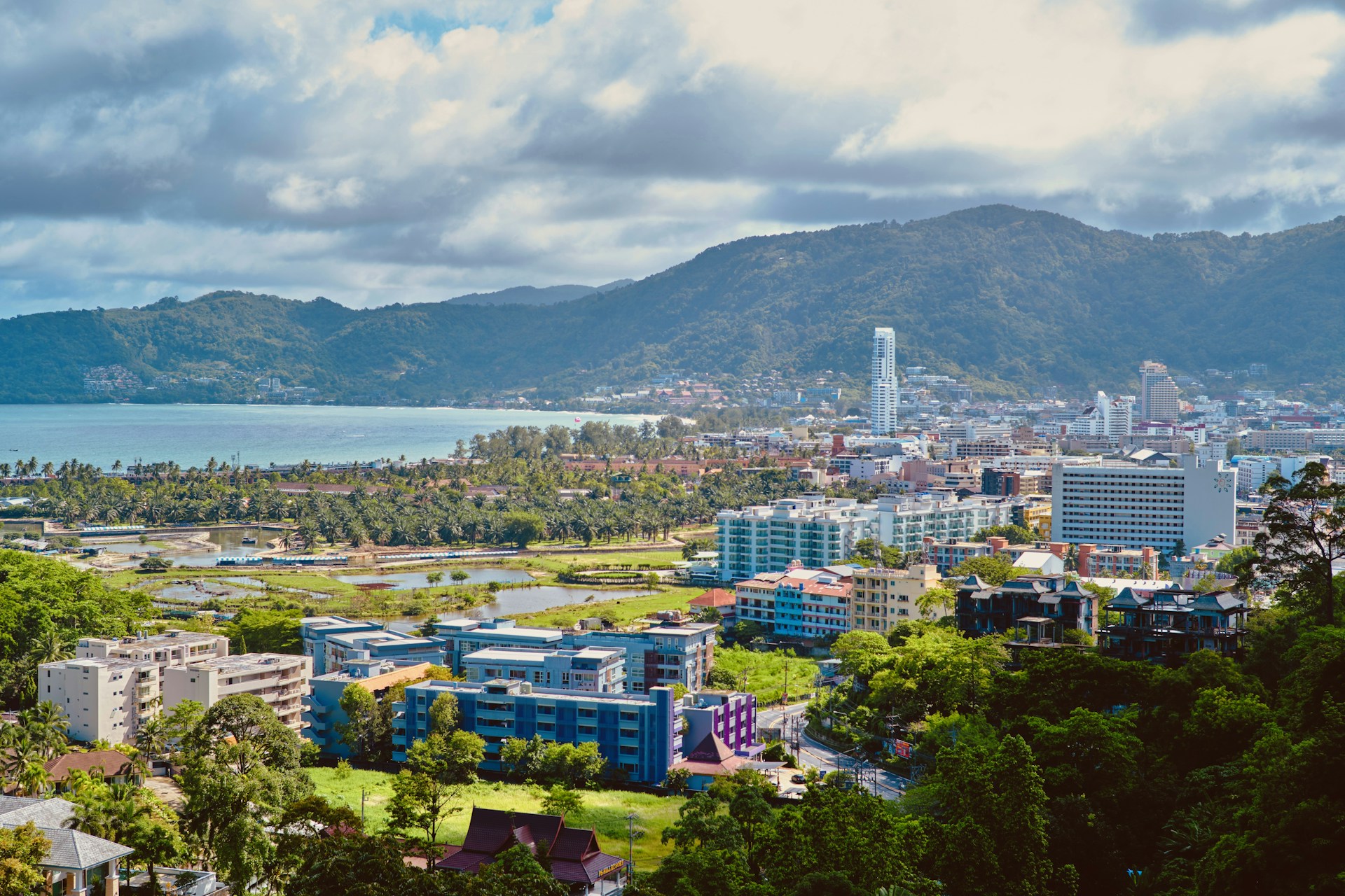 a view of a city with mountains in the background