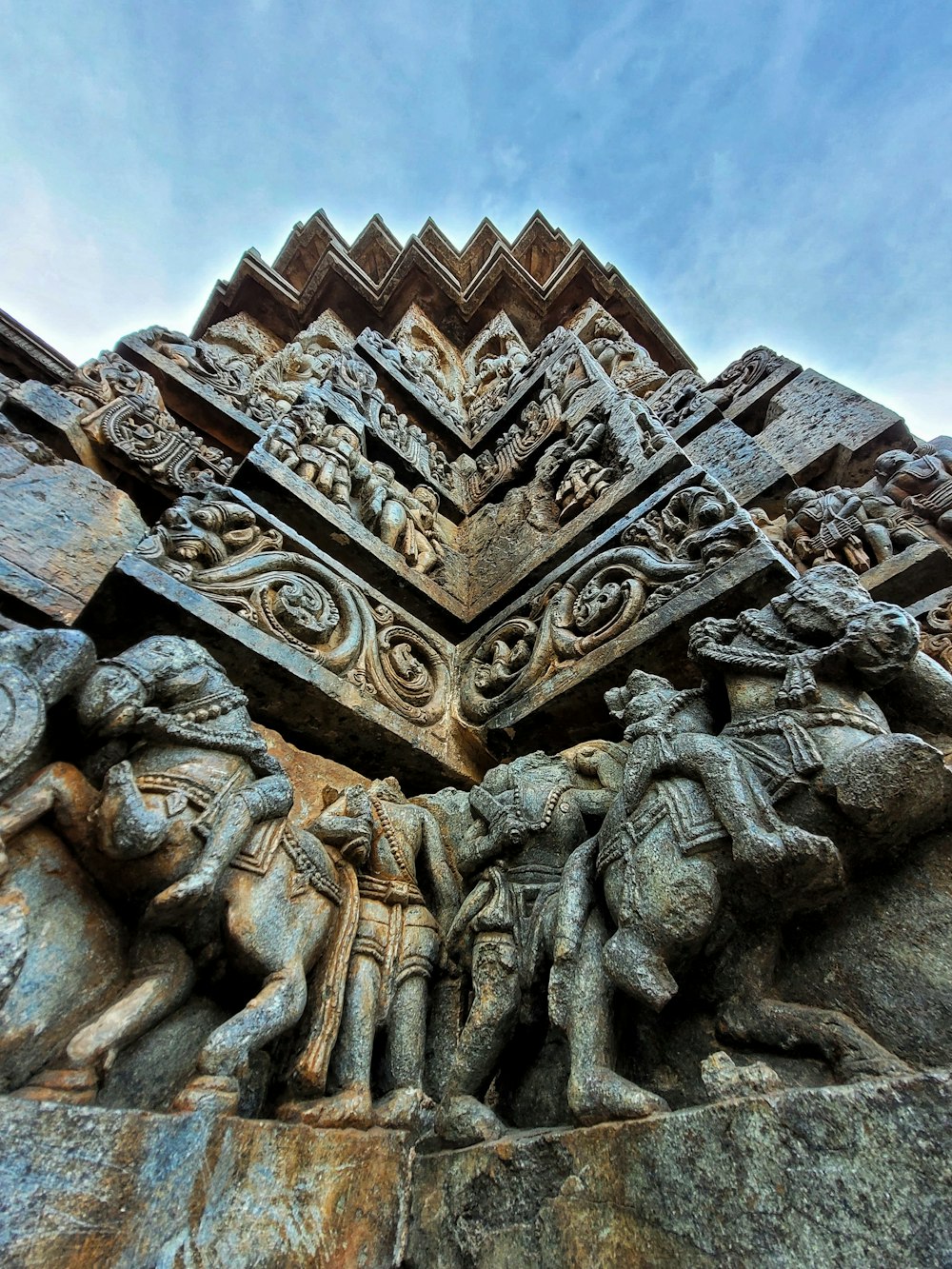 a group of statues on the side of a building