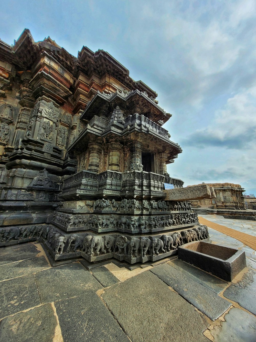 a stone structure with carvings on the side of it