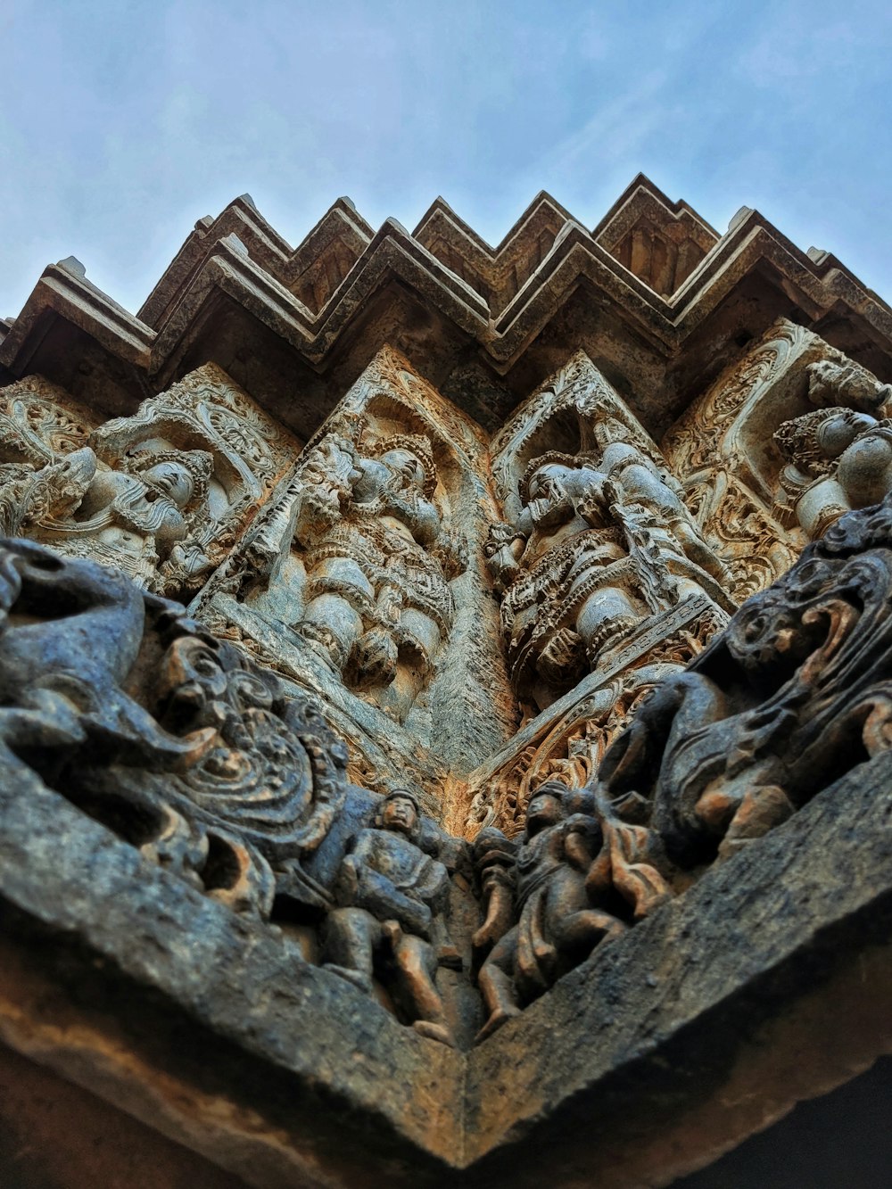 a close up of a building with carvings on it