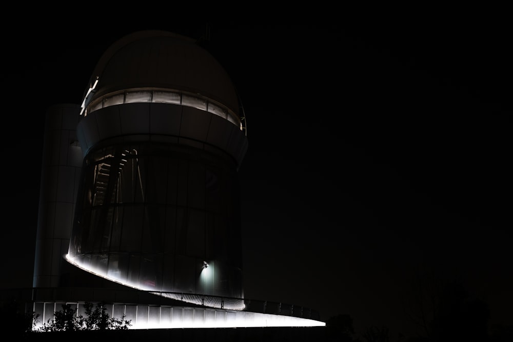 a very tall building with a very bright light on it's side