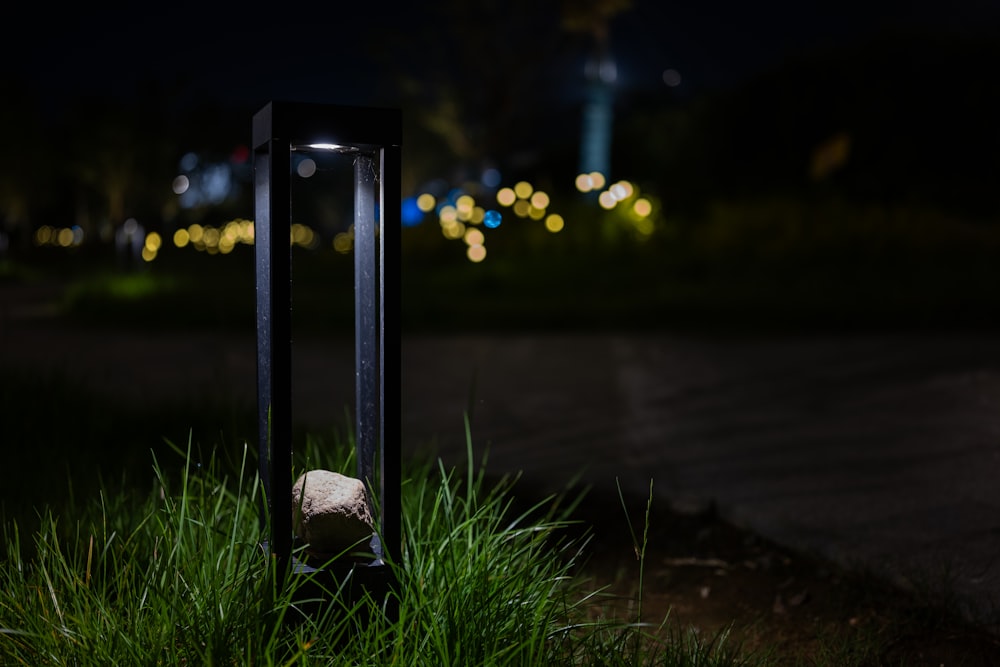 a street light sitting on the side of a road