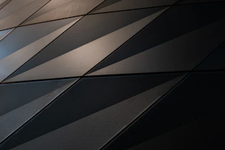 Close-up of premium materials and layered geometric patterns in a luxury interior.