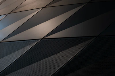 Close-up of premium materials and layered geometric patterns in a luxury interior.