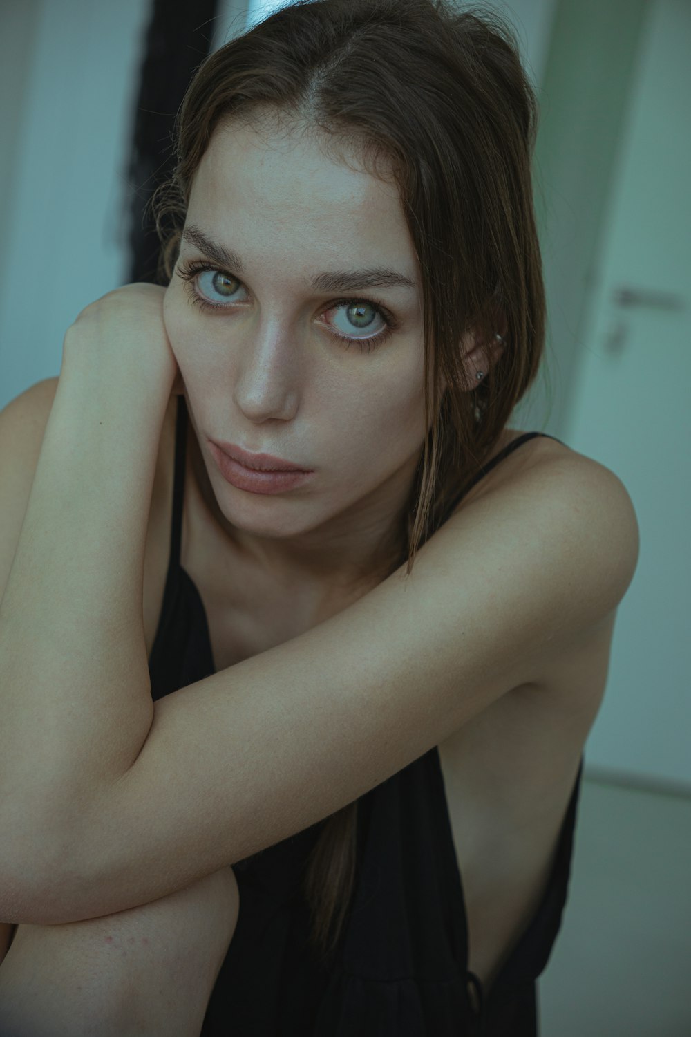 a woman with blue eyes posing for a picture