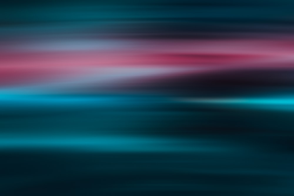 a blurry image of a blue and pink background